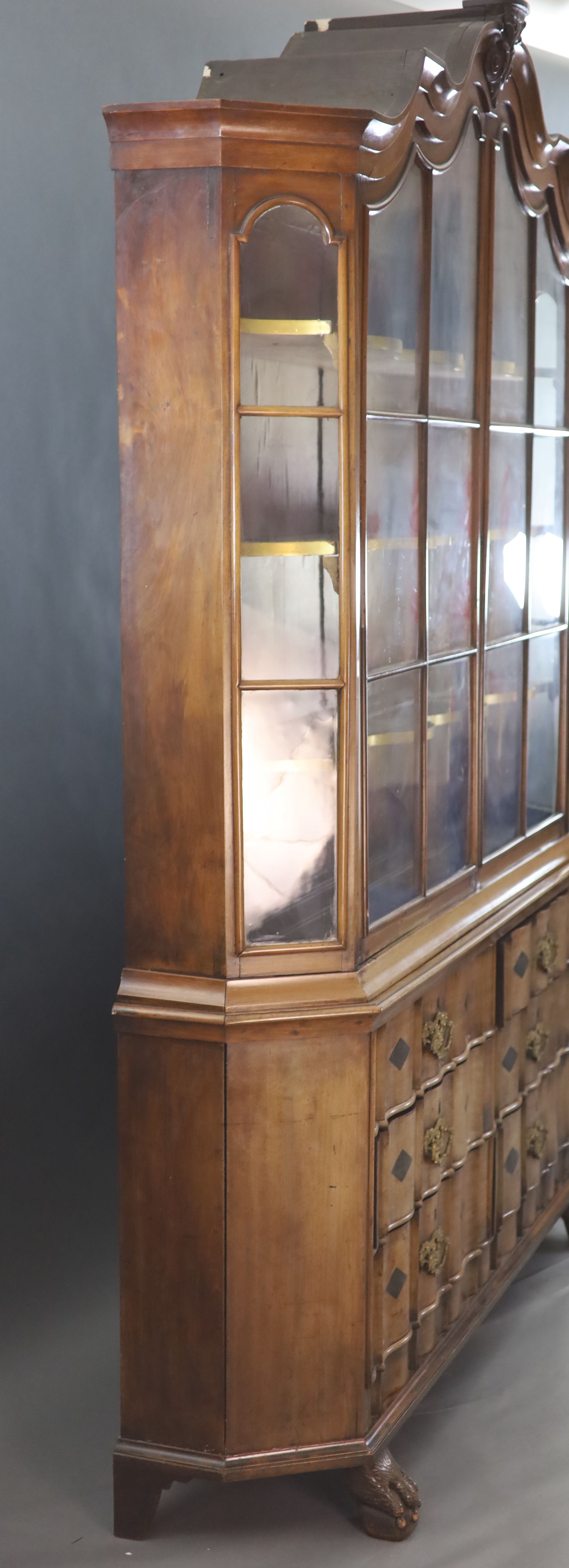 A late 18th century Dutch walnut serpentine vitrine, W.5ft 11in. D.1ft 4in. H.8ft 5in.